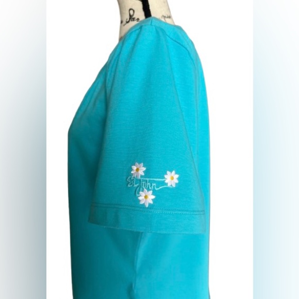 St. John Sport. Sky- blue Top with embroidery on the sleeve. Size L